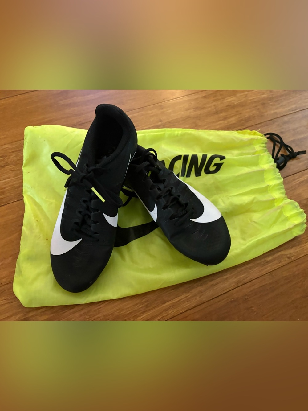 Nike Women’s Black and White Athletic Soccer Shoes with Neon Yellow Accents